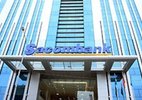 Con trai ông Trầm Bê bán cổ phiếu rút khỏi Sacombank