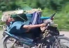 Clip Cụ già nằm trên yên và lái xe máy bằng một tay gây bão mạng