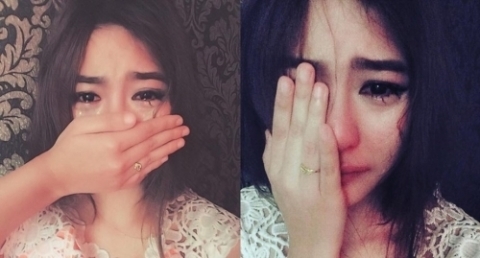 Bất ngờ trước gương mặt thật của cô gái trong ảnh vừa khóc vừa che mặt