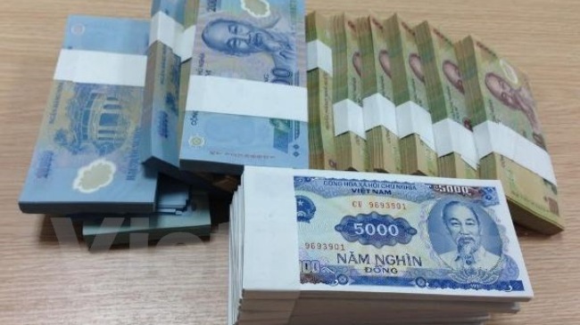 Cấm cán bộ ngân hàng đổi tiền mới ăn chênh lệch