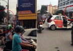 Bị CSGT dừng xe, tài xế taxi lên nóc xe 'ăn vạ'