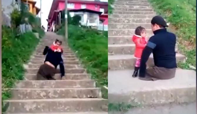 Bố không chân bế con gái lên bậc cầu thang khiến người xem xúc động