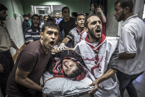 Máu thấm đỏ trường học LHQ ở Gaza vì bom Israel